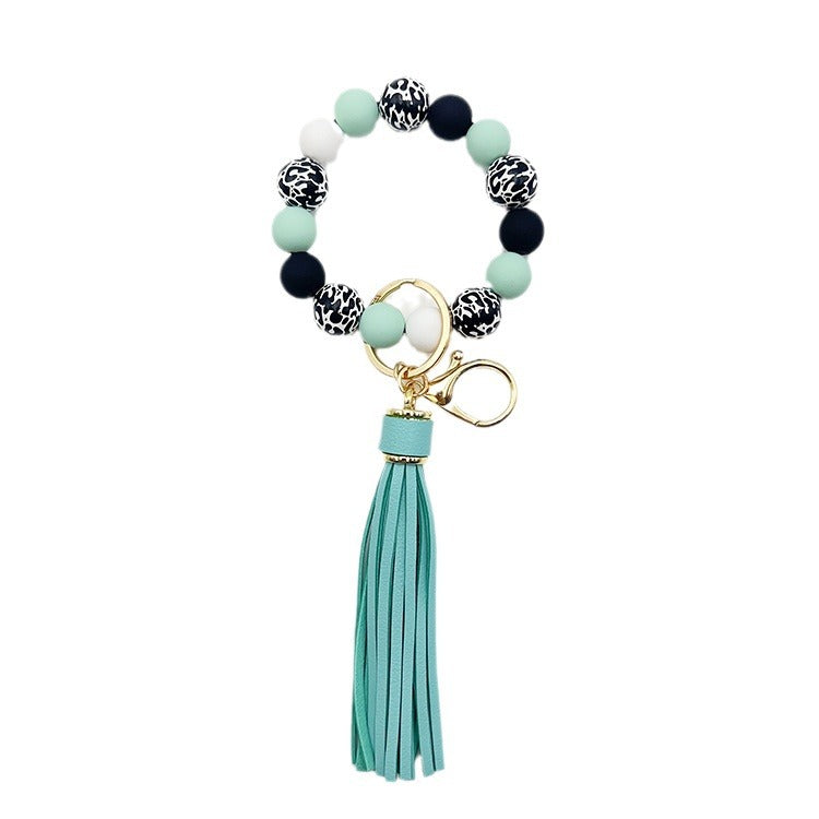Wholesale Leopard Print White Bottom Wooden Beads Rubber Paint Round Beads PU Tassel Bracelet Keychain